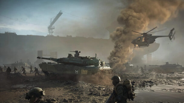 A military tank driving through a battlefield, surrounded by armored vehicles and helicopters.